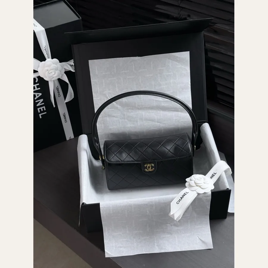 Chanel black quilted bowling bag with chain strap detail