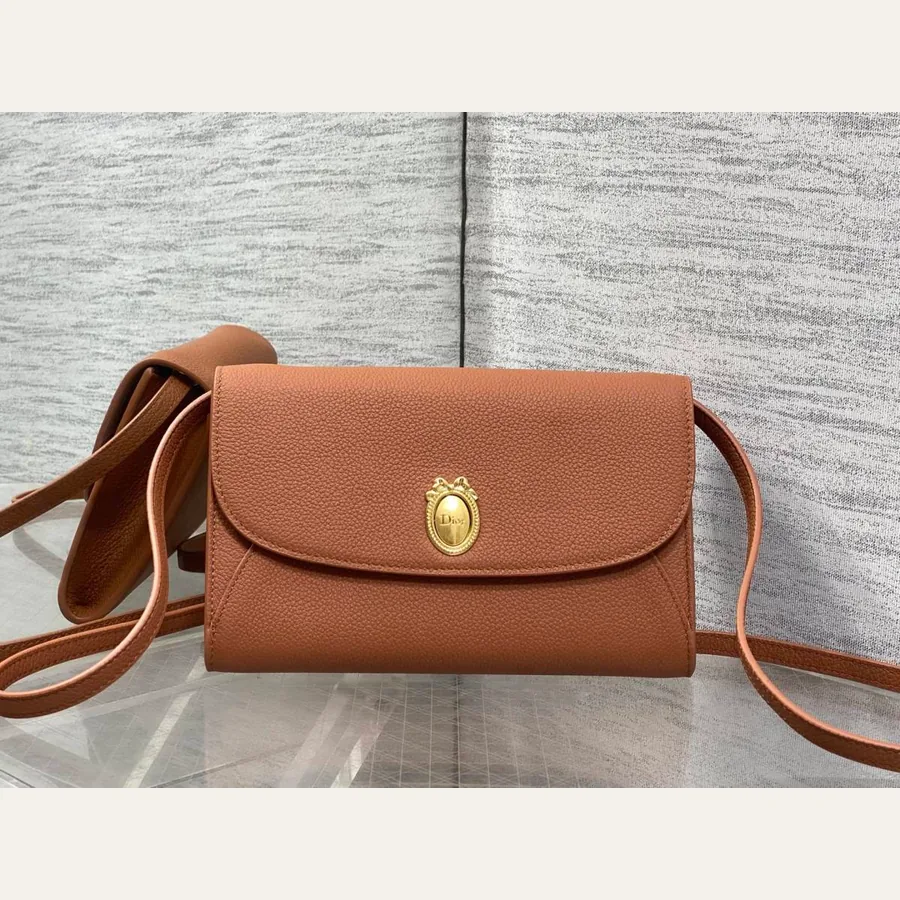 Dior compact crossbody catalog photo with adjustable strap